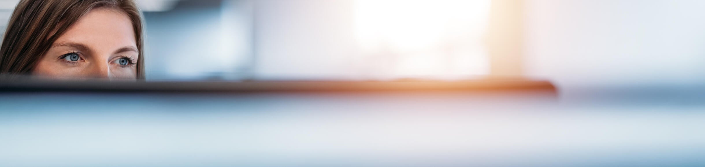 person looking out of cubicle