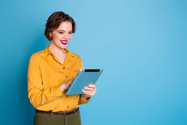 person typing on tablet